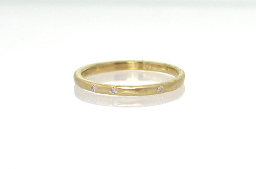18k yellow gold 2mm round band hammered, matte finish, style R480, 3 diamonds, size 7. Stephany Hitchcock Designs, www.StephanyHitchcock.com