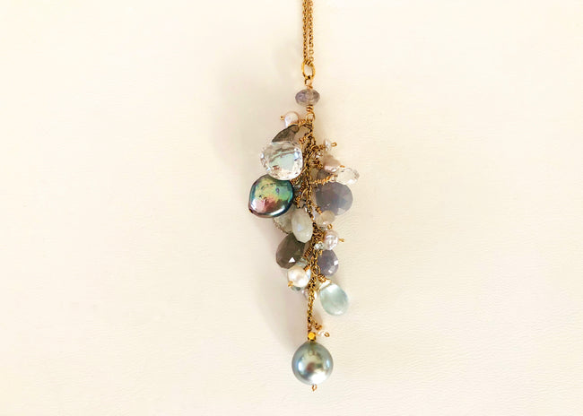 necklace with grey pearls, aquamarines, moonstones, blue sapphires, clear sapphires, Labradorite, clear topaz and small pearls. 14K