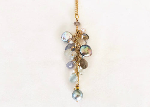 necklace with grey pearls, aquamarines, moonstones, blue sapphires, clear sapphires, Labradorite, clear topaz and small pearls. 14K