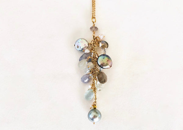necklace with grey pearls, aquamarines, moonstones, blue sapphires, clear sapphires, Labradorite, clear topaz and small pearls. 14K