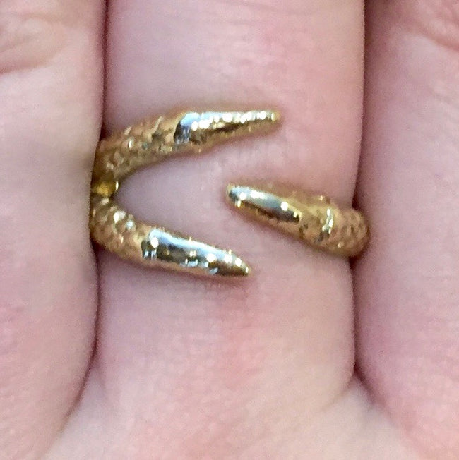 Talon ring on finger