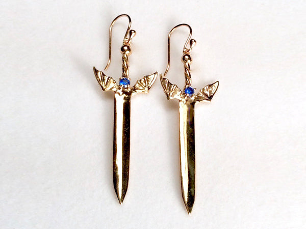 winged sword earrings, winged sword  earrings with gem, golden winged sword earrings, 
