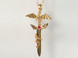 winged dragon holding a sword, winged dragon holding a sword necklace, winged dragon holding a gemstone sword, golden winged dragon holding a sword,