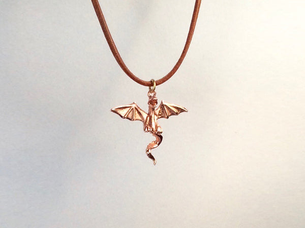 Flying Dragon necklace on  leather cord, Dragon necklace, golden bronze dragon necklace