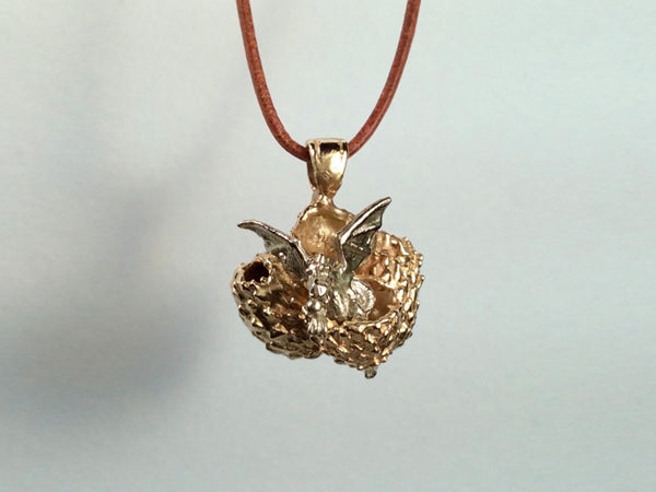 Baby dragon sitting in cracked open dragon egg- Golden and white bronze. Stephany Hitchcock Designs, www.StephanyHitchcock.com